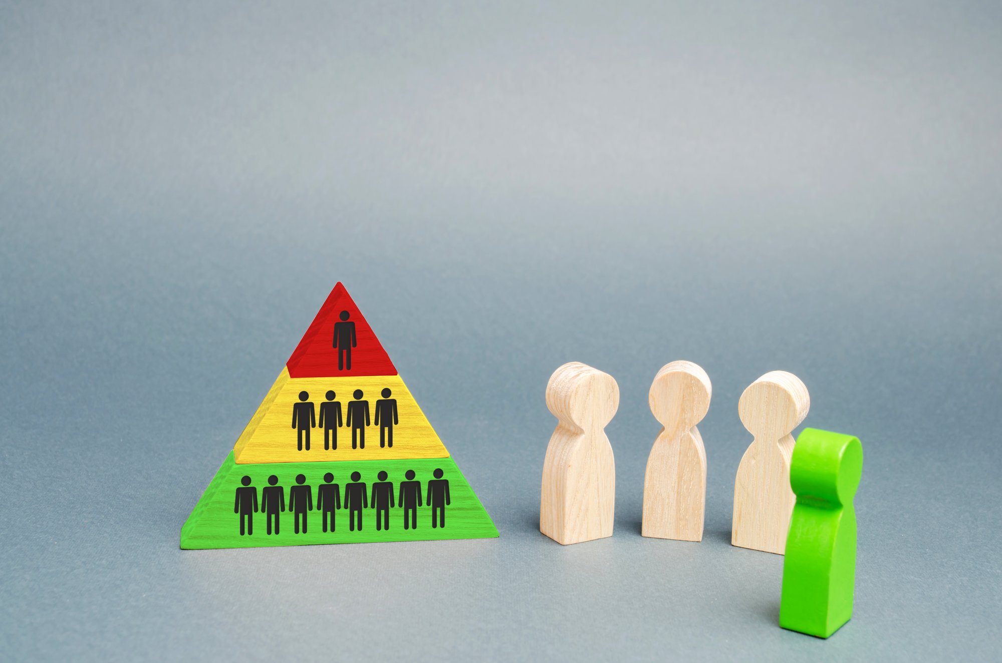 hierarchical-pyramid-and-wooden-figures-of-people-2025-04-01-22-39-08-utc